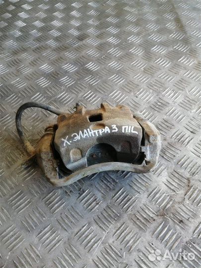 Суппорт тормозной передний левый Hyundai Elantra