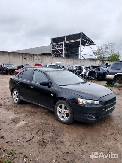 Суппорт тормозной передний Mitsubishi Lancer CY