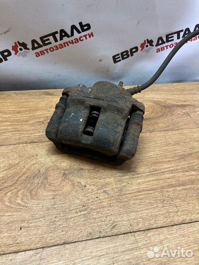 Суппорт тормозной передний левый Logan