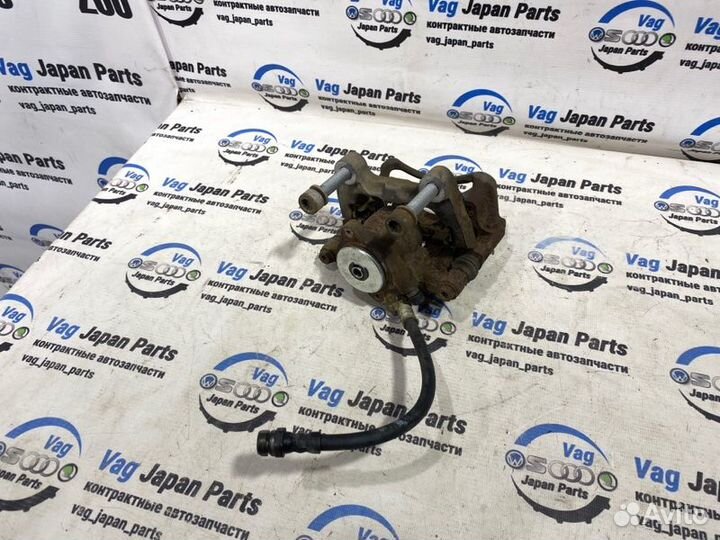 Суппорт тормозной задний левый Volkswagen Tiguan