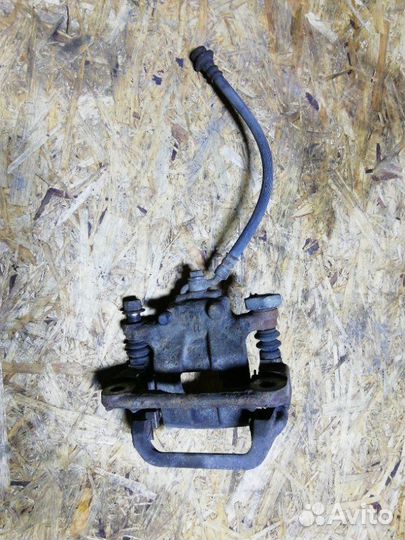 Суппорт тормозной задний правый Nissan Teana L33