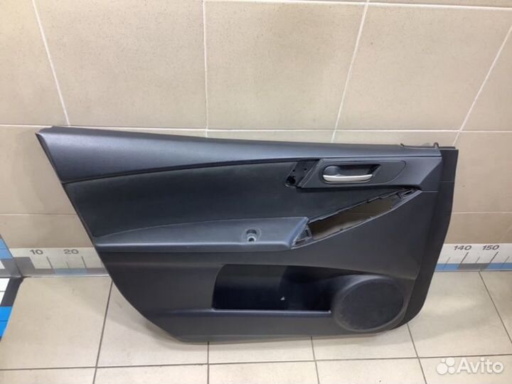 Обшивка двери передней левой передняя левая Mazda