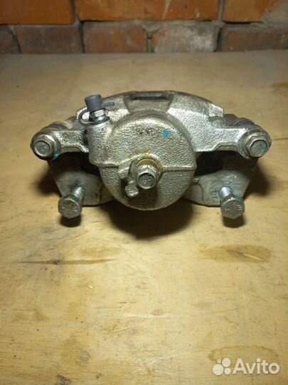 Суппорт тормозной левый Chevrolet Lachetti (J200)