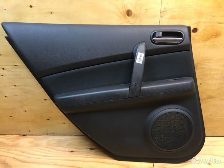 Обшивка двери лев. зад. mazda atenza