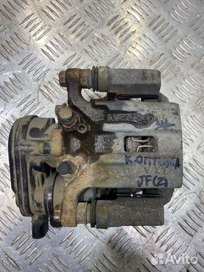 Суппорт тормозной задний левый Kia Optima 4 JF