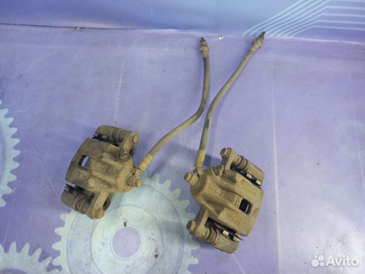 Суппорт тормозной задний Kia Sportage 2