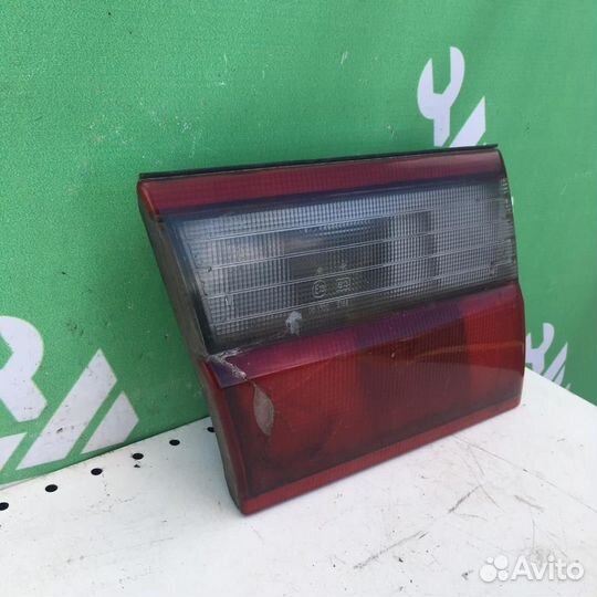 Фонарь задний внутренний левый Тойота Карина Е