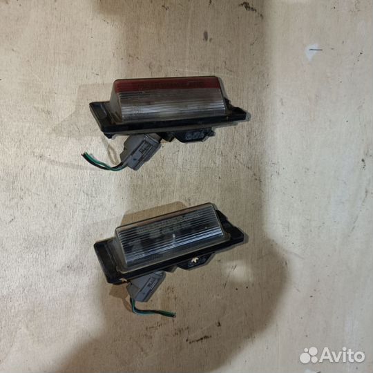 Фонарик подсветки номера Mitsubishi Lancer 2005г