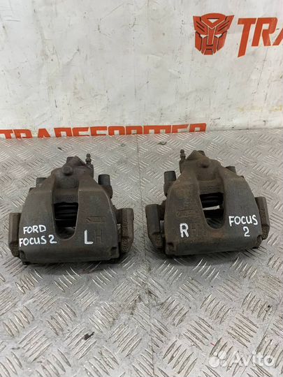 Суппорт тормозной передний левый Ford Focus 2