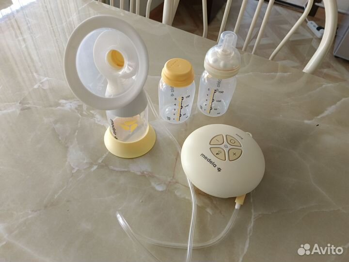 Молокоотсос medela электрический