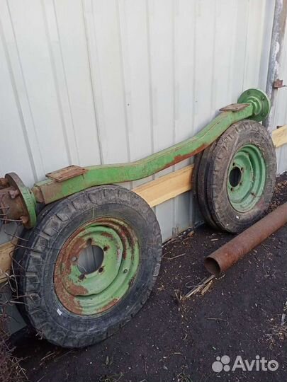 Ось с колесами