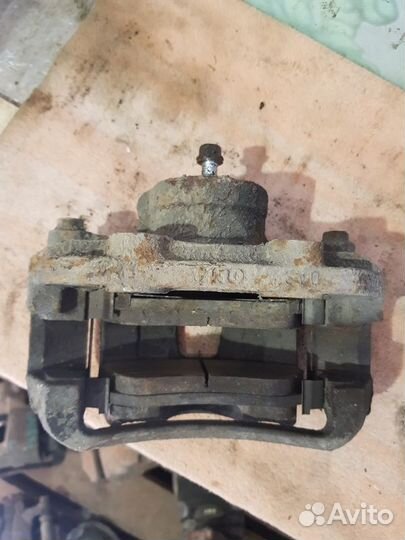 Суппорт тормозной передний левый Daewoo Nexia