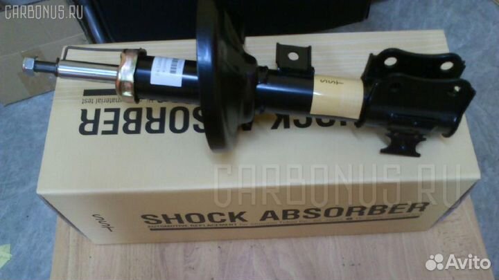 Амортизатор передний левый Suzuki Aerio SX