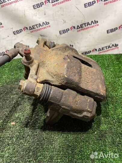 Суппорт тормозной передний правый Toyota Carina E