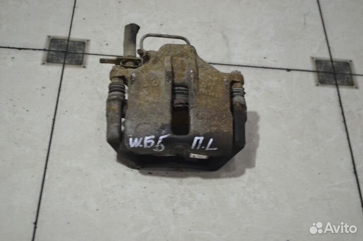 Тормозной суппорт передний левый Volkswagen Passat