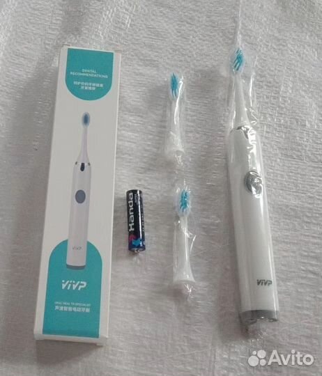 Электрическая зубная щетка