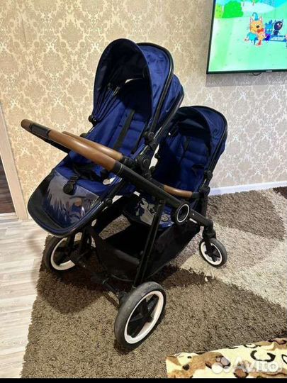 Коляска для двойни погодок