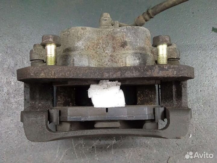 Тормозной суппорт передний KIA Sorento 1