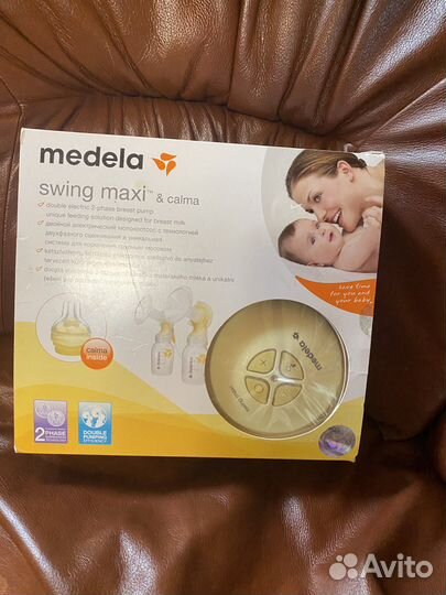 Молокоотсос medela swing maxi