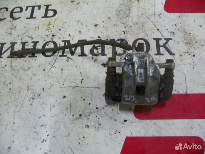 Суппорт тормозной задний правый Kia Sportage