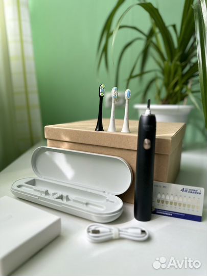 Электрическая зубная щетка