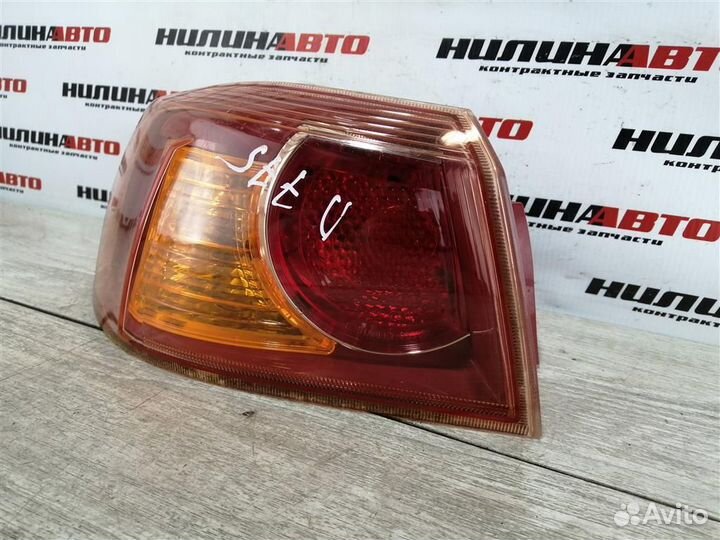 Фонарь левый Митсубиси Лансер 10