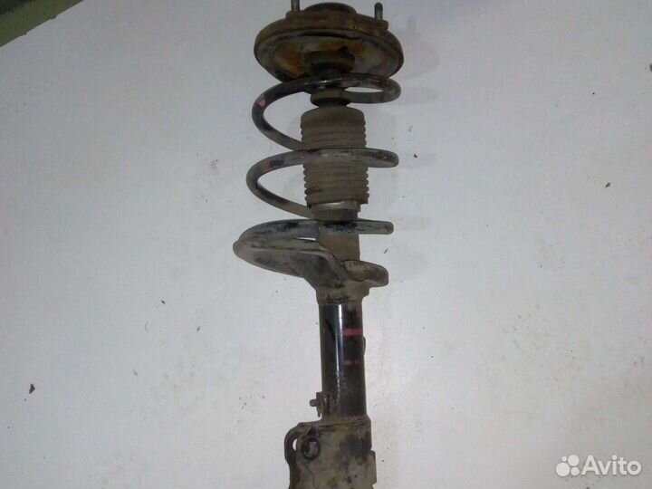 Амортизатор передний правый Митцубиси Ланцер 10