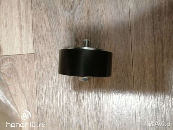 Ролик натяжителя ремня