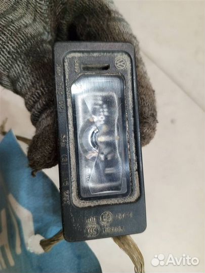 Фонарь подсветки номера Skoda Rapid 2012