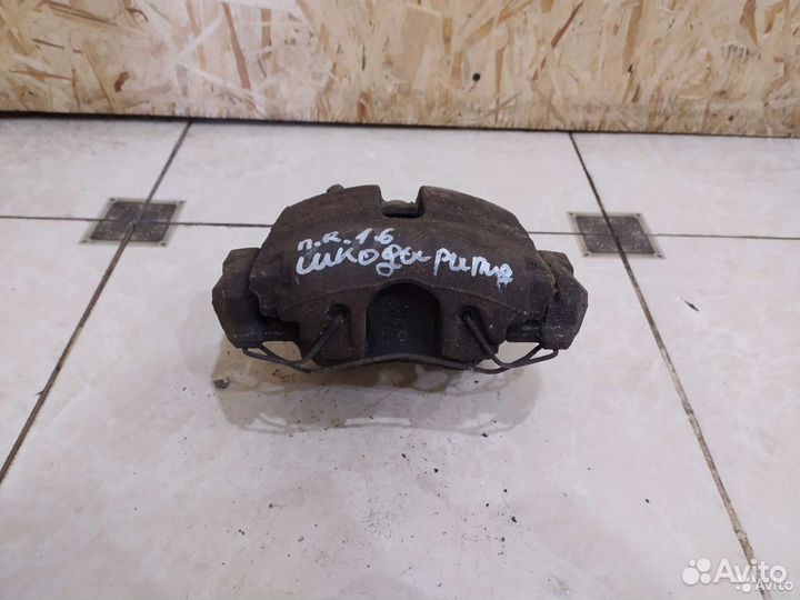 Тормозной суппорт передний правый Skoda Rapid