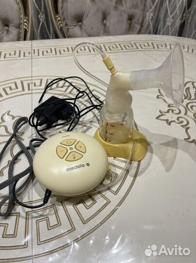 Молокоотсос medela электрический