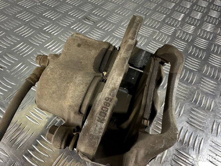 Суппорт тормозной передний левый Мазда сх7