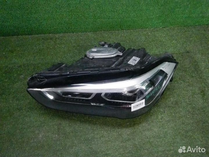 Фара левая BMW X1