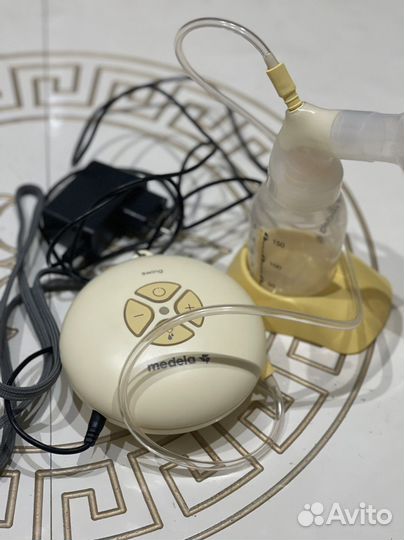 Молокоотсос medela электрический