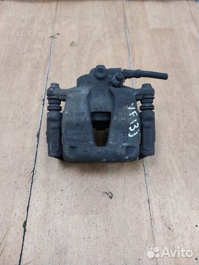 Тормозной суппорт передний левый Opel Corsa D