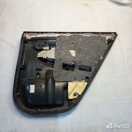 Обшивка двери задняя левая Toyota Corolla E150