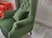 Интерьерное каминное кресло с высокой спинкой