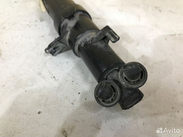 Форсунка омывателя фар передняя левая