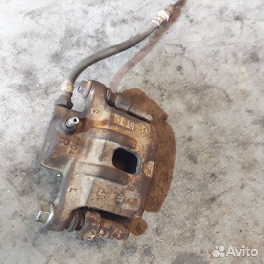 Суппорт левый задние Мицубиси Лансер 9