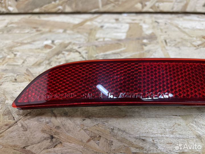 Отражатель в задний бампер левый Toyota Camry 75