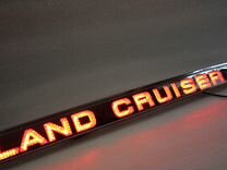 Планк�а Land Cruiser 100 над номером с подсветкой