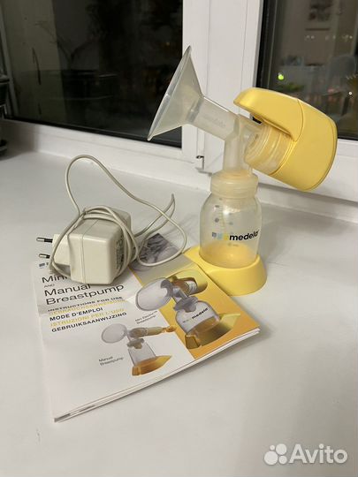 Молокоотсос medela электрический