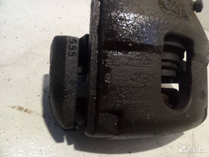 Суппорт тормозной передний левый Ford Fusion рест