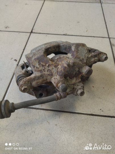 Суппорт тормозной передний левый Chevrolet Cruze