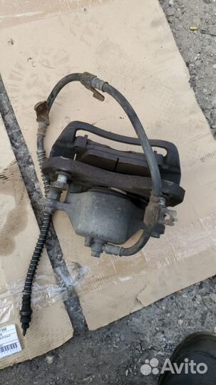 Суппорт передний правый KIA opirus