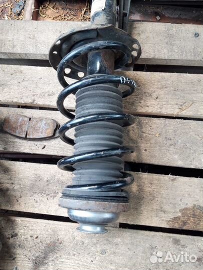 Стойка амортизатор Opel Astra H Zafira B