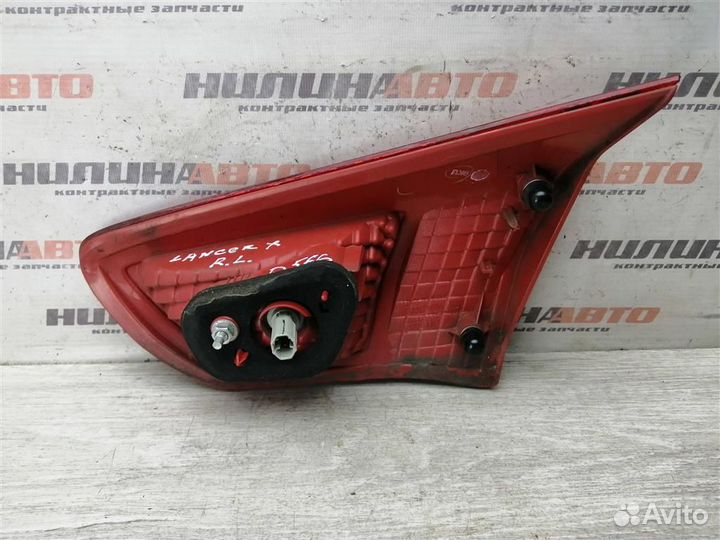 Фонарь левый в крышку багажника Митсубиси Лансер