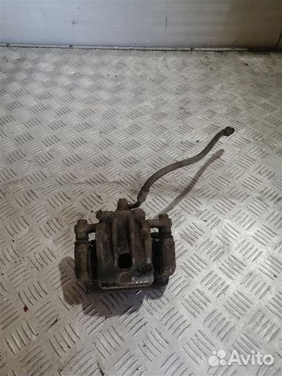 Суппорт тормозной задний левый Ssangyong Actyon