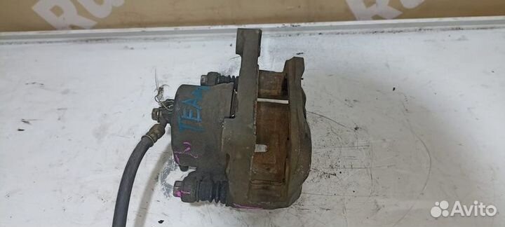 Суппорт тормозной левый Nissan Teana J31 VQ23 VQ35