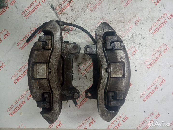 Суппорт тормозной передний Volkswagen Passat B6